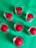 7 Red Candles with Glass Holders